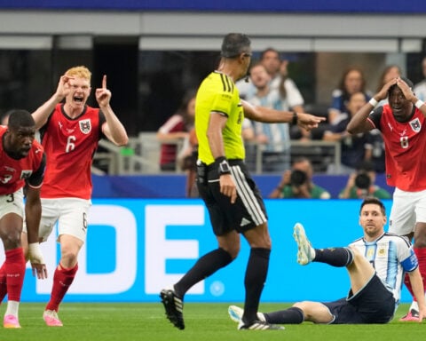 Messi sets World Cup scoring record as defending champion Argentina advances to knockout stage