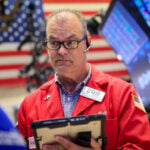 Trading Day: Mixed signals, Wall Street wobbles