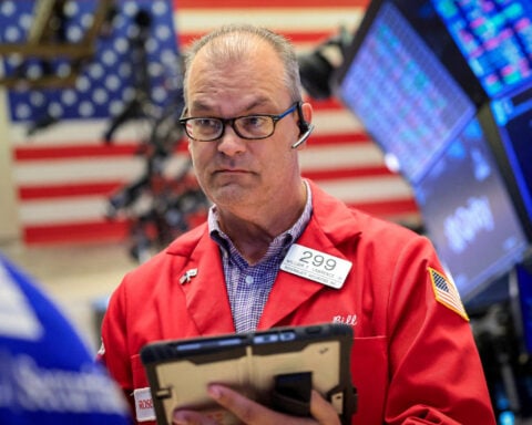 Trading Day: Mixed signals, Wall Street wobbles