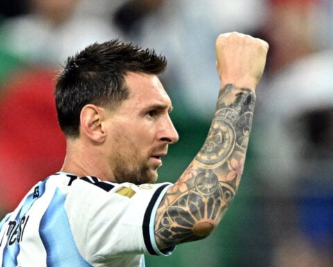 Soccer-Messi breaks World Cup scoring record with a stunning double