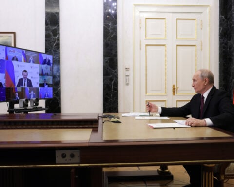 Ukraine says it hit a railway bridge to Crimea, seeking to isolate the Russian-held peninsula