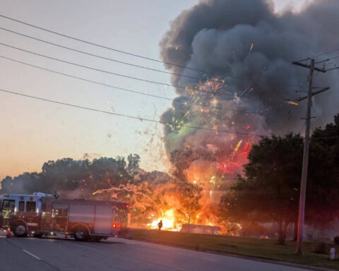 Fireworks stand fire caught on video with flames and fireworks shooting skyward