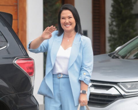 Keiko Fujimori vows to unite a Peru 'split in two' as runoff lead holds