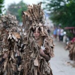 Philippine devotees honor St. John the Baptist with a mud-covered display of faith