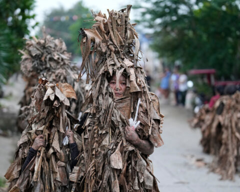 Philippine devotees honor St. John the Baptist with a mud-covered display of faith