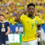 Vinícius Júnior scores 2 goals as Brazil beats Scotland 3-0 to reach World Cup knockout stage