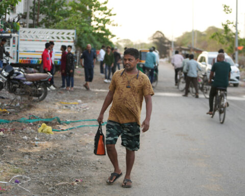 How one Indian textile worker copes with extreme heat in factory work and cramped living quarters