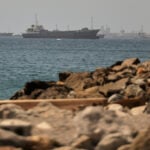 An oil tanker navigates the Strait of Hormuz despite threats from Iran's Revolutionary Guard
