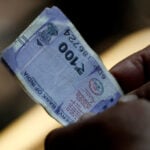 Bears loosen grip on rupiah, rupee on lower oil prices, policy support: Reuters poll