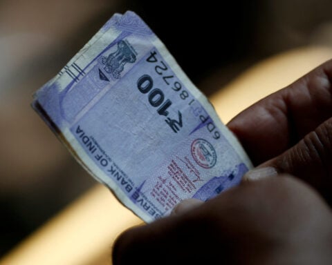 Bears loosen grip on rupiah, rupee on lower oil prices, policy support: Reuters poll