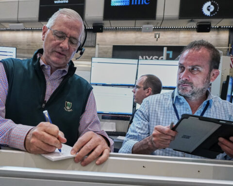 Wall Street drifts in mixed trading after Micron soars and Apple drops