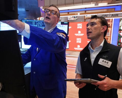 Wall Street drifts in mixed trading after Micron soars and Apple drops