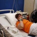 In sweltering French hospital, air-conditioned waiting room offers some relief