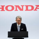 Honda CEO apologises for company's loss, wins investor backing at annual meeting
