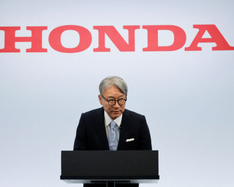 Honda CEO apologises for company's loss, wins investor backing at annual meeting