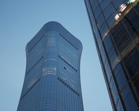 Small aircraft crashes into Beijing's tallest building, eyewitnesses say