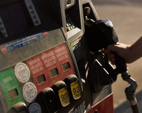 Americans are feeling a little better about the economy as gas prices ease