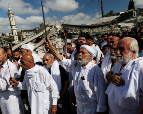Shi'ite Muslims mark their holiest day in war-battered Lebanon