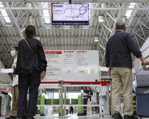2 tropical storms pound Japan with floods and landslides, killing 1