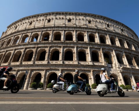 Vespa riders take to roads in Rome to mark 80th birthday