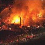 2 juveniles charged with arson and causing a catastrophe in massive fire