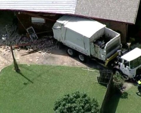 Garbage truck breaks loose while being towed, rolls into Dallas home, authorities say