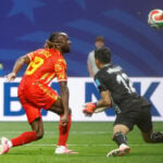 Congo rallies to a 3-1 win against Uzbekistan to seal place in the World Cup knockouts