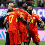 Congo rallies to a 3-1 win against Uzbekistan to seal place in the World Cup knockouts