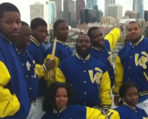 Drill team celebrates 35 years with parade, new street sign despite heavy rain