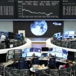Markets swivel on tech, Mideast angst