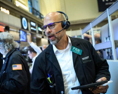 Wall St indexes climb as US, Iran halt attacks; Comcast surges on spin-off plan