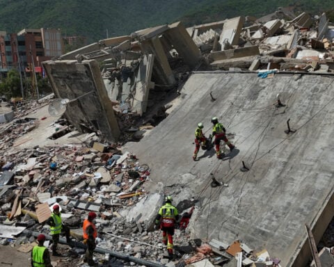 A strong aftershock rattles Venezuela as rescue workers race to find survivors