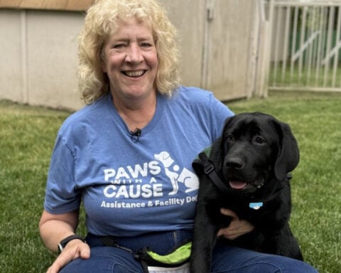 'This is my passion': Woman raises service dog puppies and thousands for Paws With A Cause