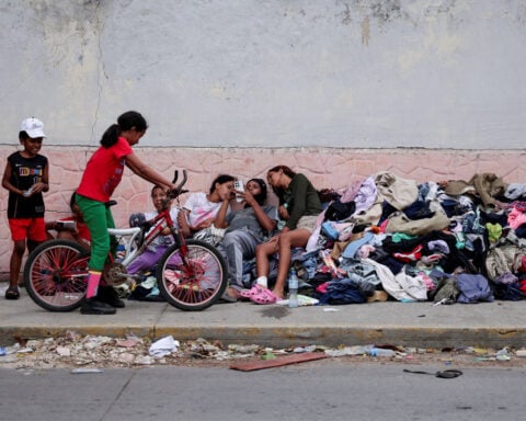 Families of Venezuelans deported from the US and lost in hotel collapse search for loved ones, and for answers