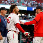 A bat flip, a shout of 'Venezuela' and tears for home as Red Sox 1B Willson Contreras plays on