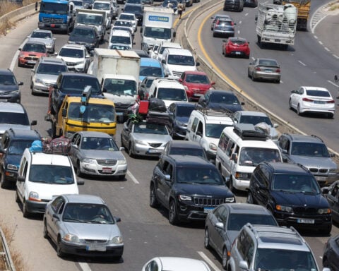 Hundreds of thousands of Lebanese head home as fighting eases, many still stranded