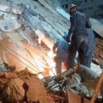 Rescuers in Venezuela pluck child alive from collapsed building six days after twin quakes
