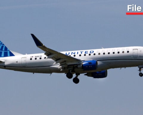 FAA investigating after a passenger tried to open cabin door on regional jet, forcing an emergency landing