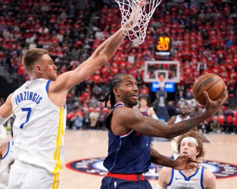 Center Kristaps Porzingis re-signing with Warriors on two-year, $40 million deal