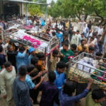 Mourners attend funerals for 14 Pakistani children killed in tutoring center roof collapse