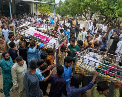 Mourners attend funerals for 14 Pakistani children killed in tutoring center roof collapse