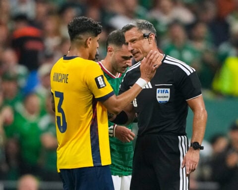 Why are World Cup refs giving red cards to players covering their mouths when confronting opponents?