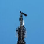 Two people unfurl peace banner atop NY's Empire State Building in apparent proposal stunt