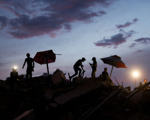 Between silence and shouts, rescuers dig for Venezuela twin quake survivors
