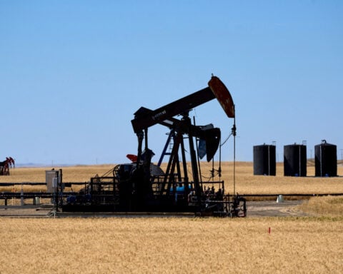 Oil gains on short-covering buys ahead of US holiday