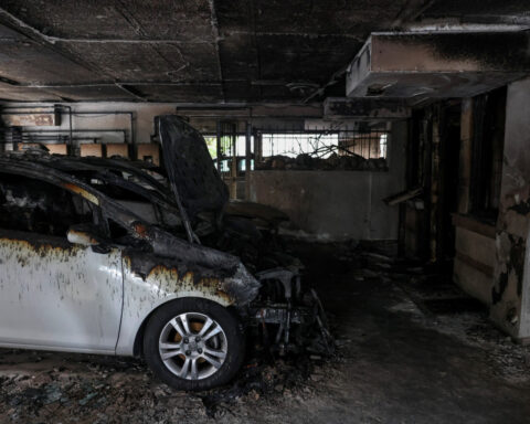 Greek ruling party calls for protests after firebomb kills candidate's mother