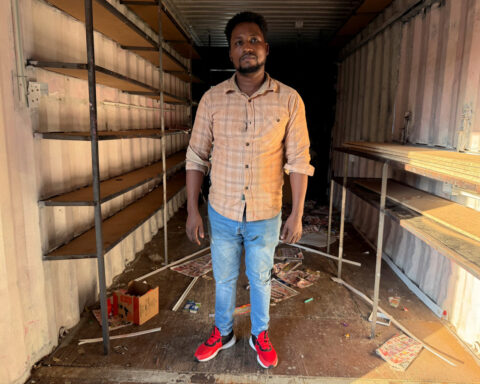 Scared but staying: Some migrants dig in as South Africa turns hostile