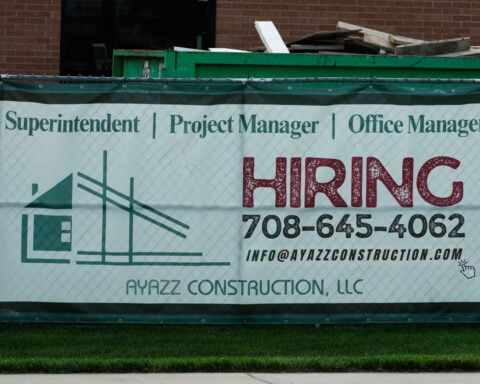 U.S. filings for jobless aid fall to 215,000 as layoffs remain at historically healthy levels