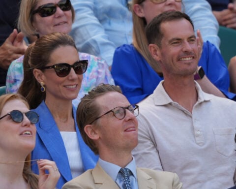 Princess Kate greets fans at Wimbledon and sits next to Andy Murray to watch the tennis