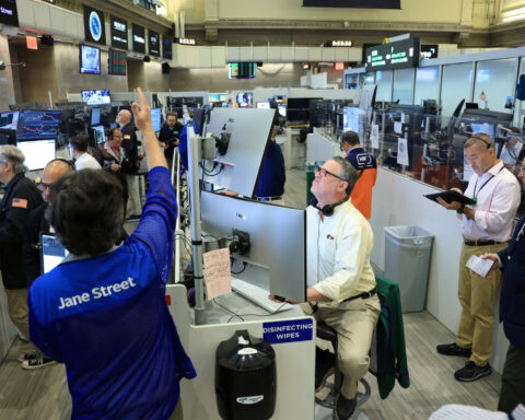 Dollar slides after jobs data, chipmakers weigh on stocks